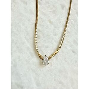 Gold flat chain mod style necklace with pear cut cubic zirconia